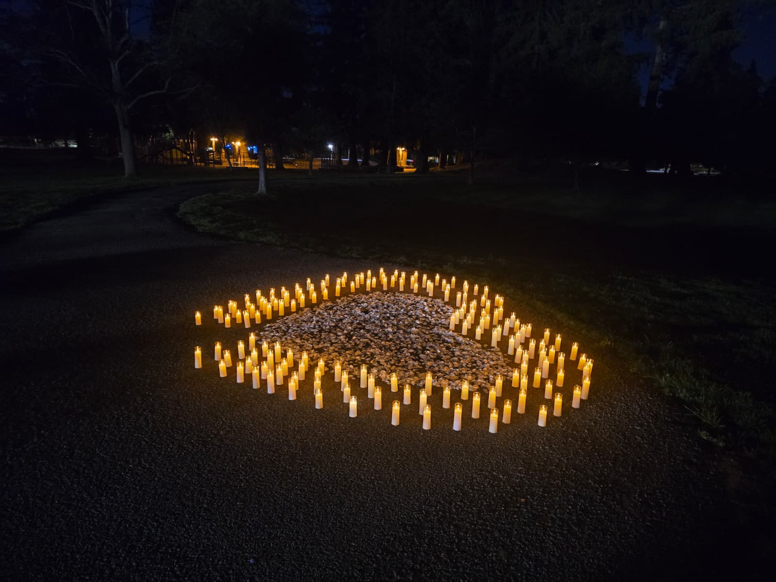 Heart shaped candle and petal arrangement for a romantic proposal setup