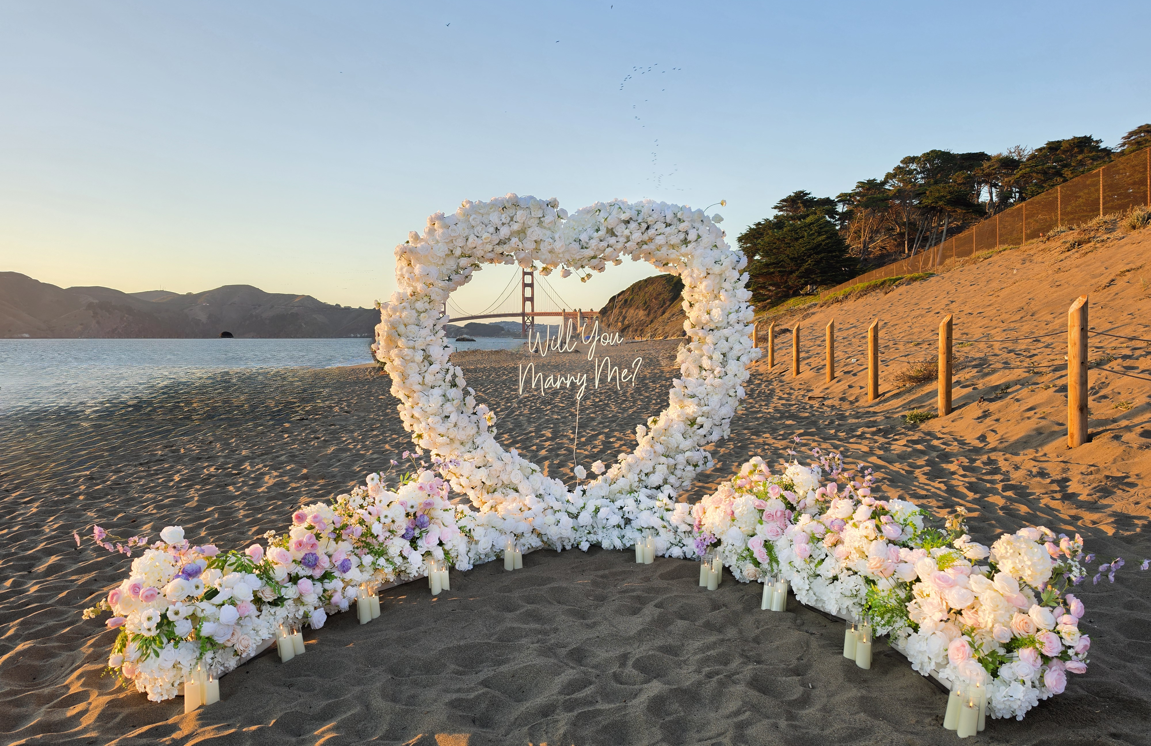 The Blooming Heart – floral heart arch proposal setup at Baker Beach