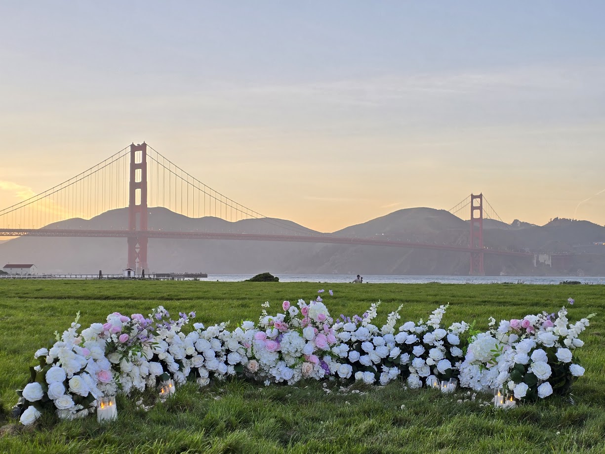 Custom proposal setup at Crissy Field, San Francisco with grounded floral arrangements