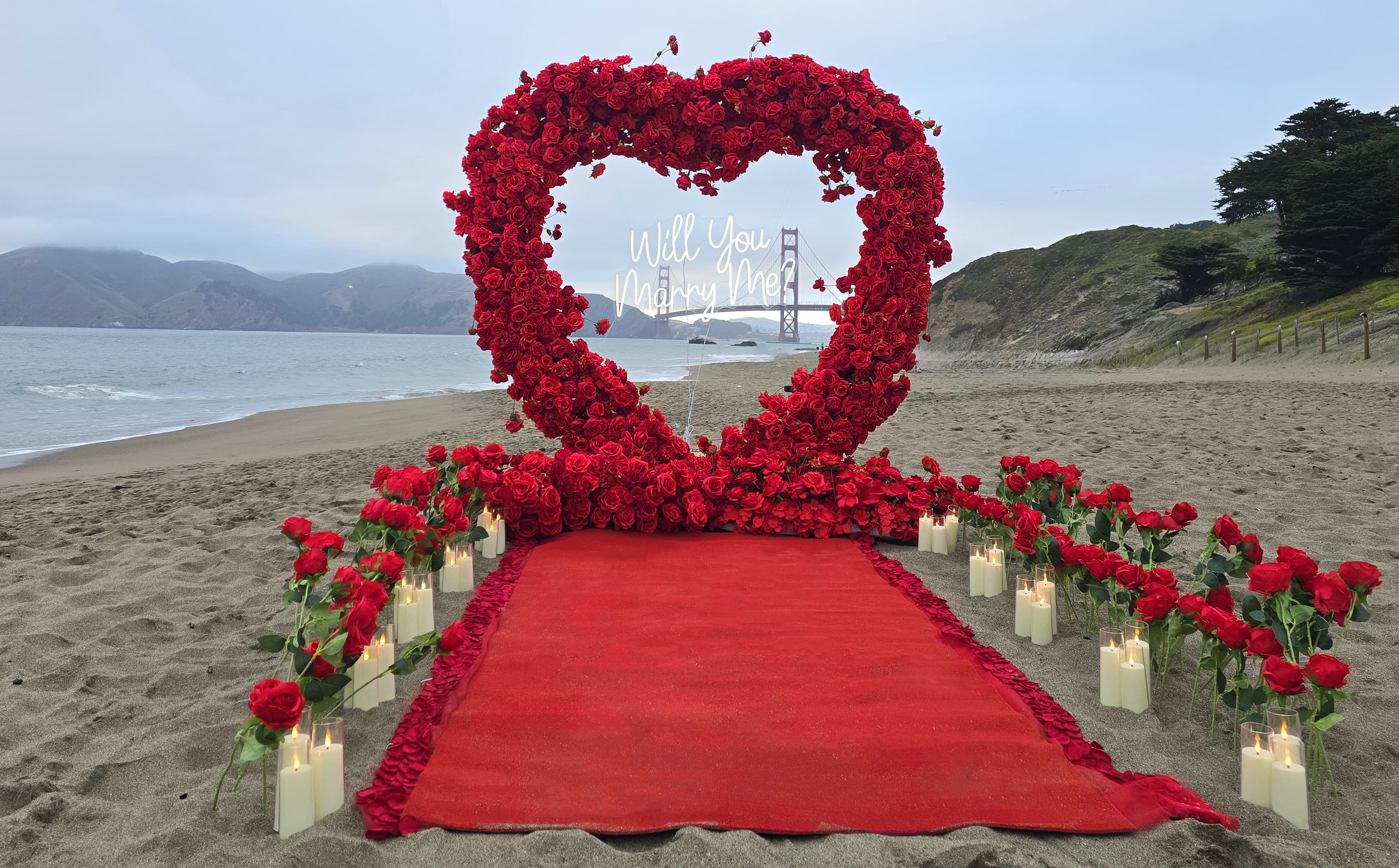The Masterpiece Package red heart arch proposal at Baker Beach with the Golden Gate Bridge