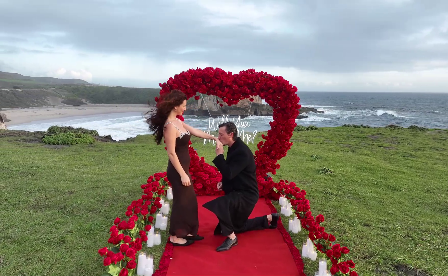 Romantic clifftop proposal setup overlooking the ocean on the California coast near Santa Cruz